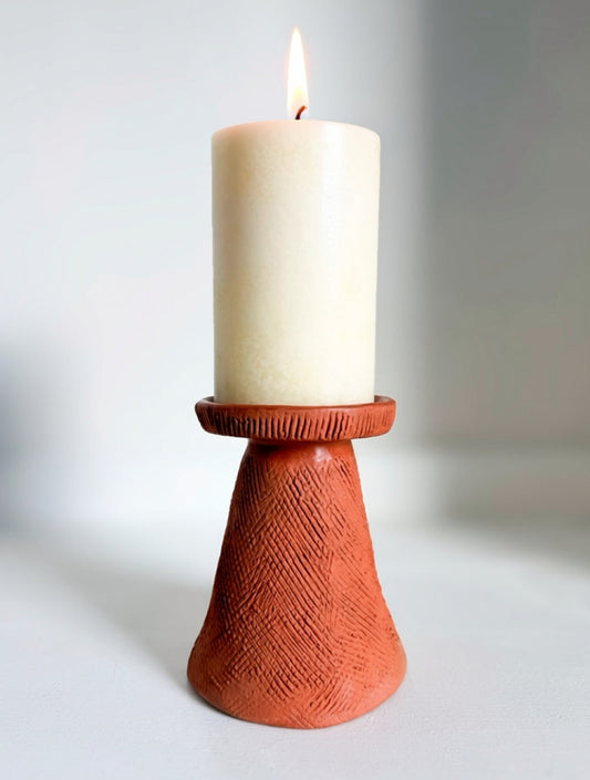 Candle in a terracotta holder 